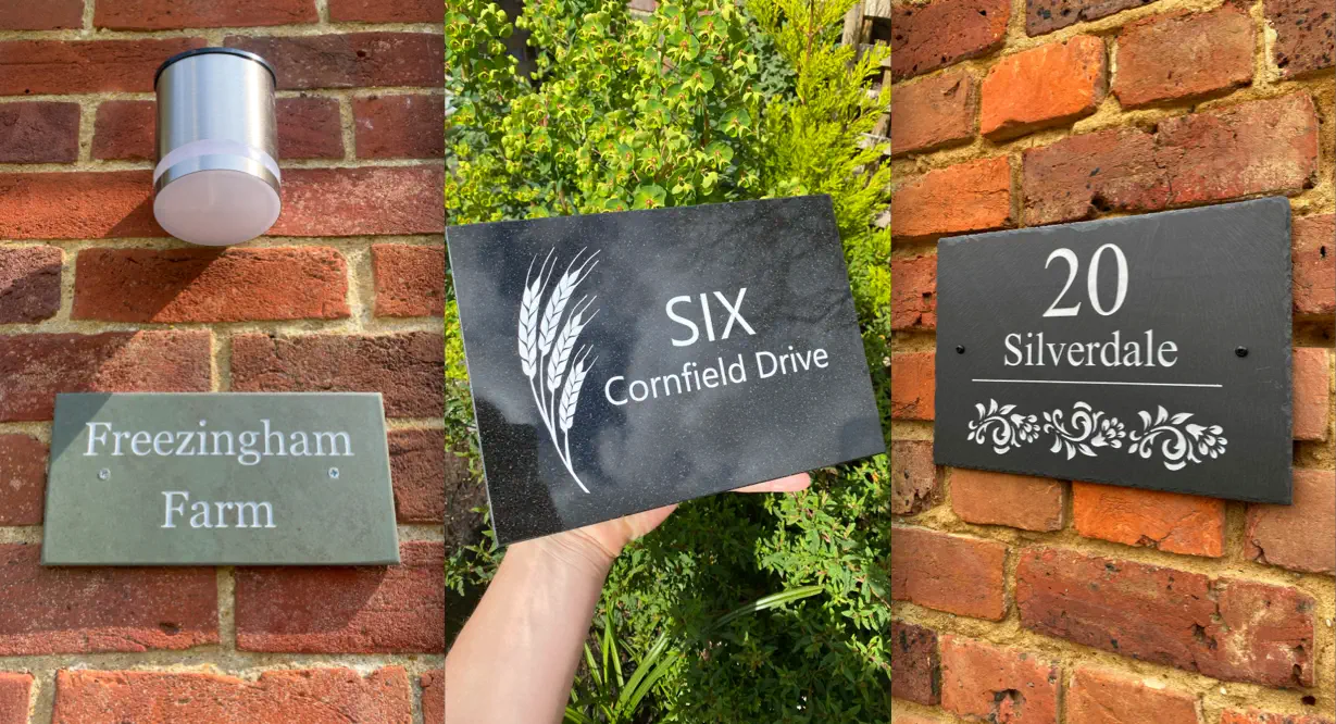 A collage of three personalized house signs on brick walls: “Freezingham Farm” on green slate, “SIX Cornfield Drive” on black granite with a wheat design, and “20 Silverdale” on dark slate with floral accents.