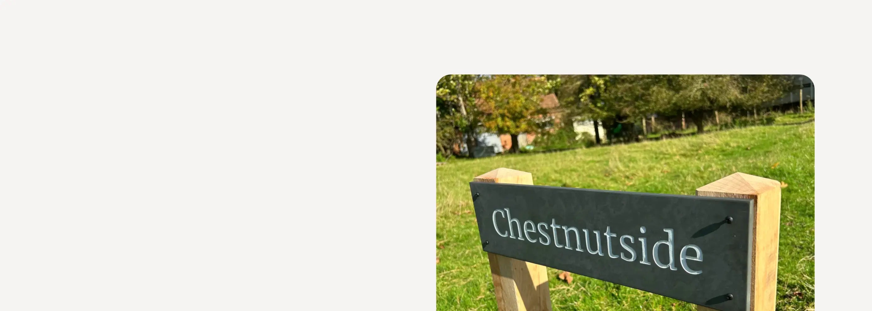 Digital design tool for creating signs with a grassy field and signboard background.