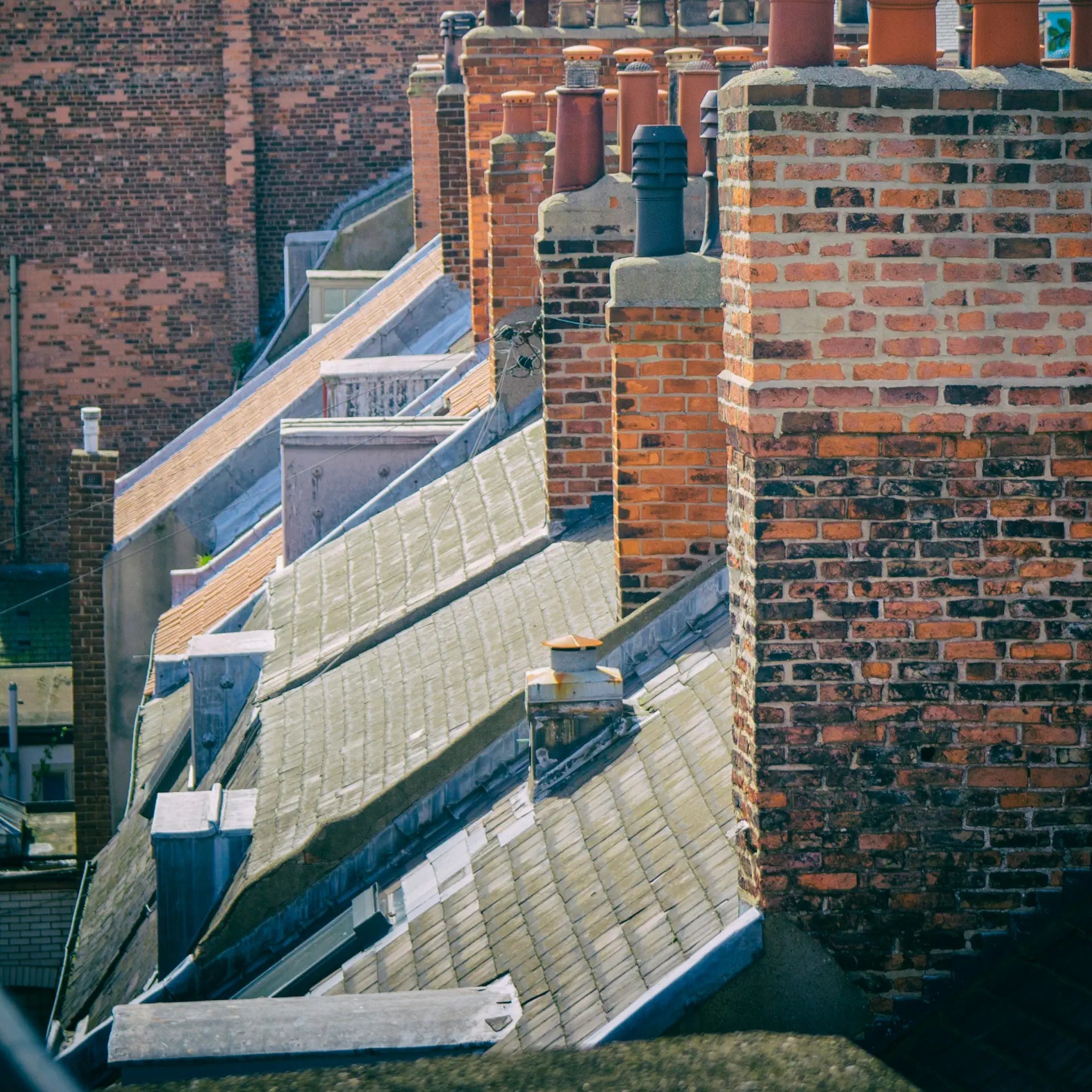 Roofs and brick walls of an urban building complex