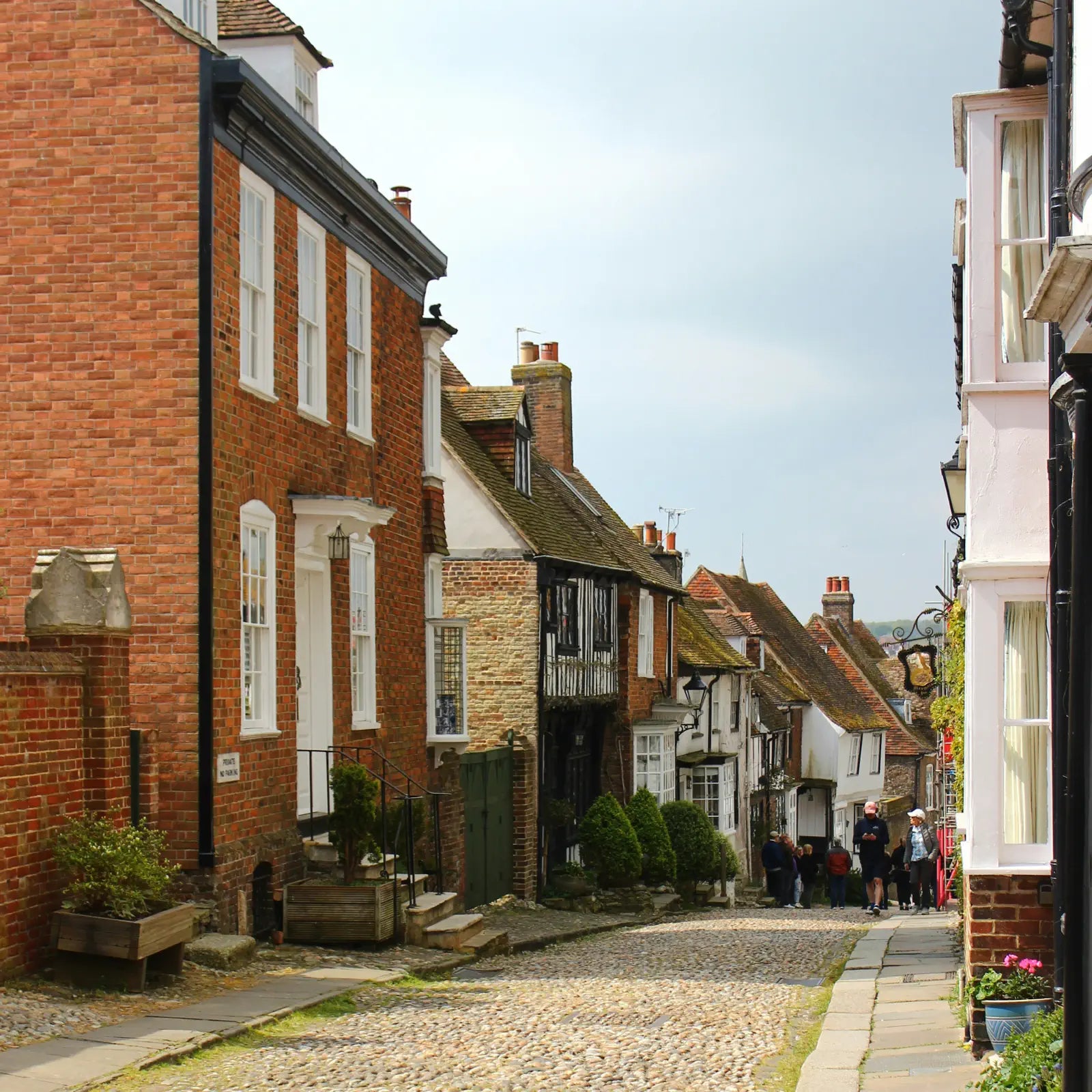 Cobbled street with traditional brick buildings in Rye.