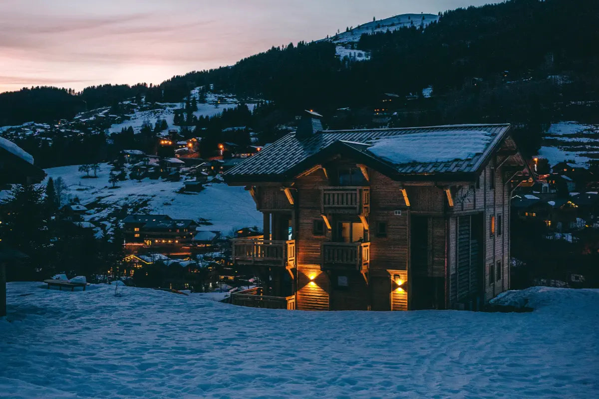 wooden house at night in cold mountain village