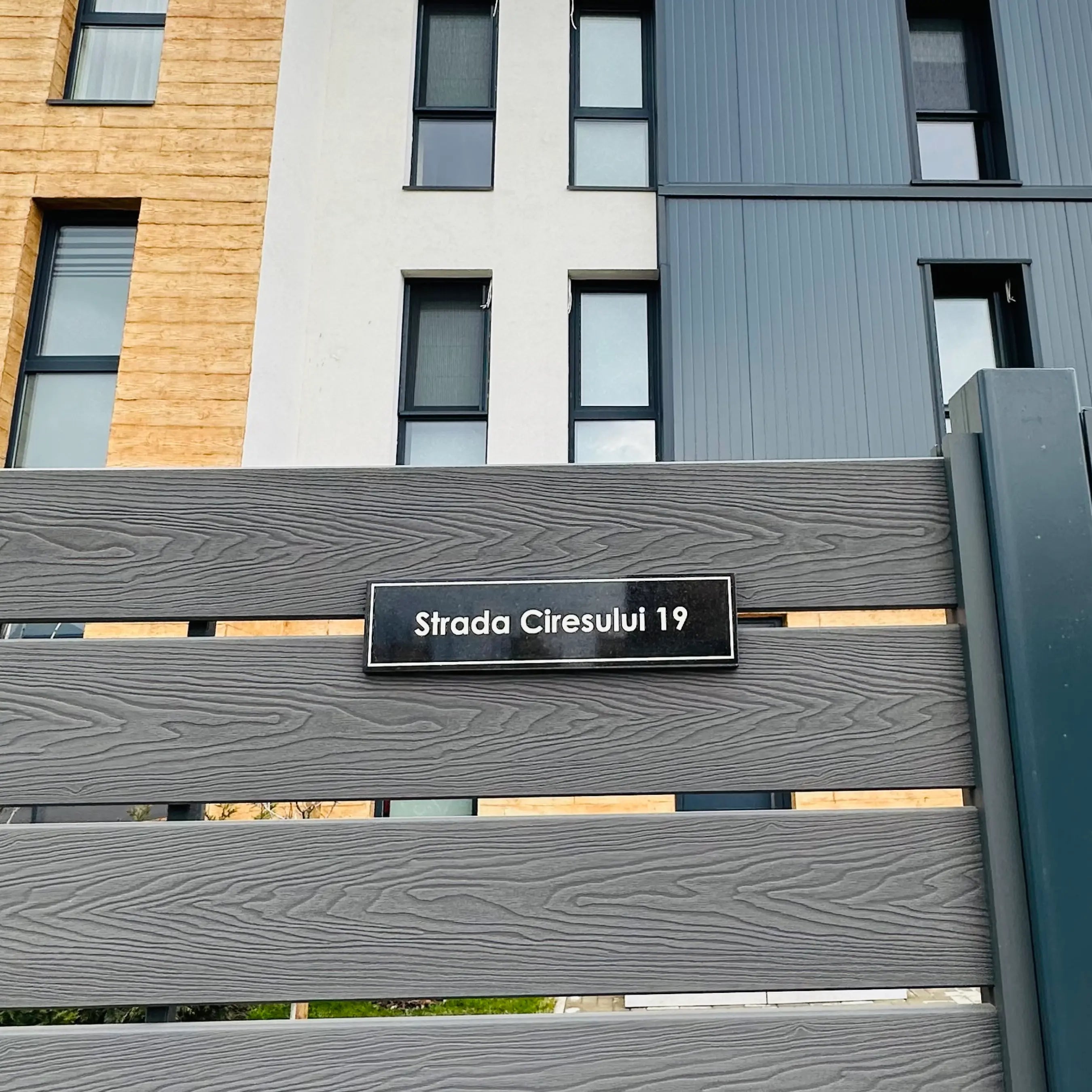 Address sign on a modern building facade with architectural details