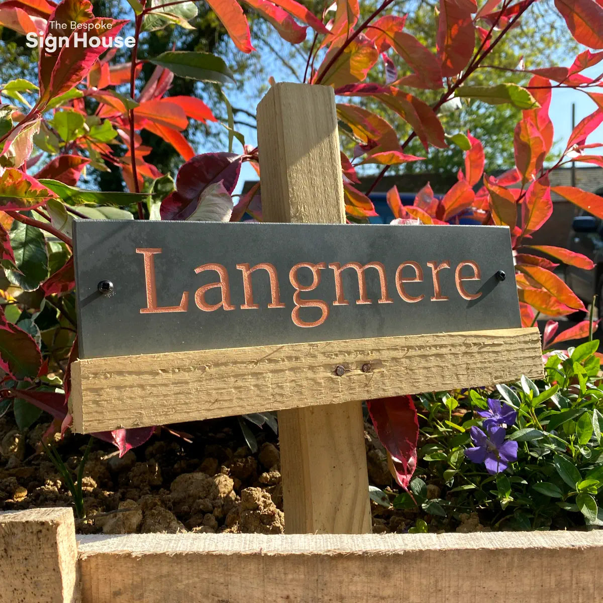 long rectangle house sign with copper coloured engraving