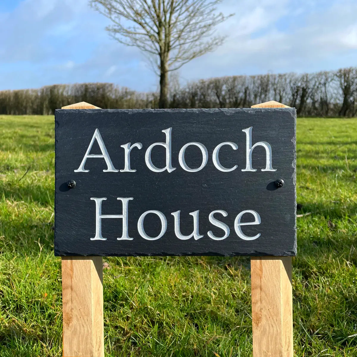 wooden posted welsh house sign