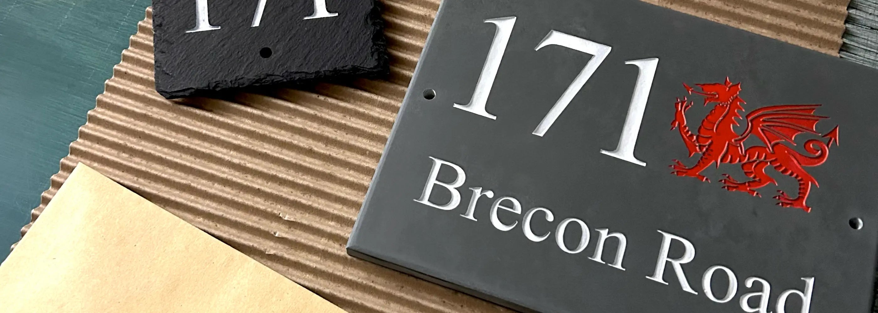 Welsh slate house sign with red Welsh dragon