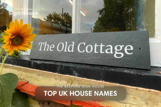 Engraved riven slate house sign with white text paint lettering