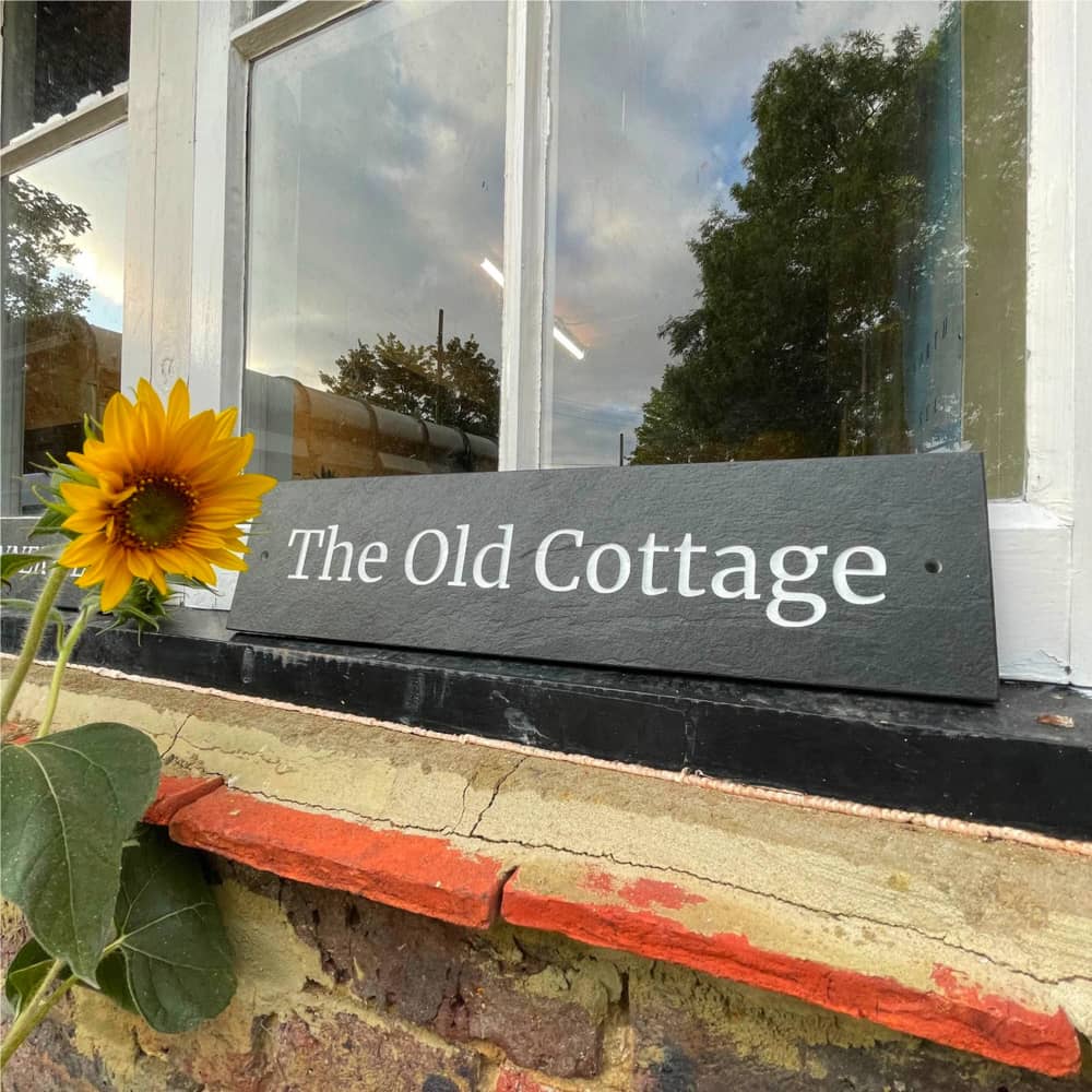 House sign reading 'The Old Cottage'
