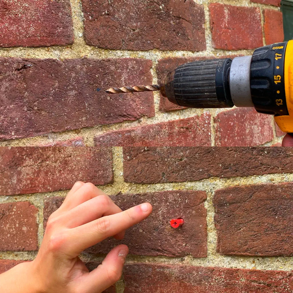 holes drilled into brick wall for sign screw fixings