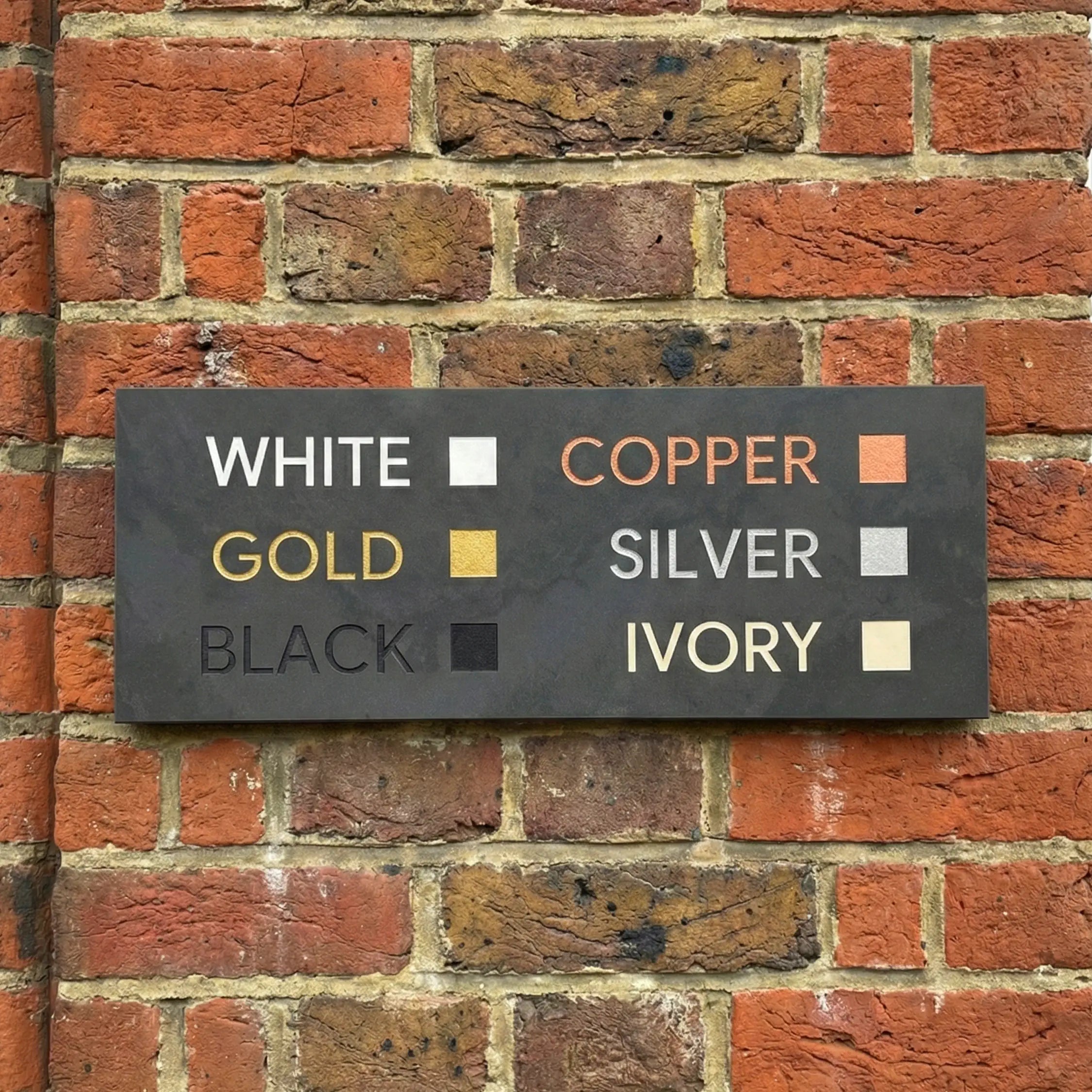 Engraving colour previews: black, white, gold, silver, copper examples on slate house signs