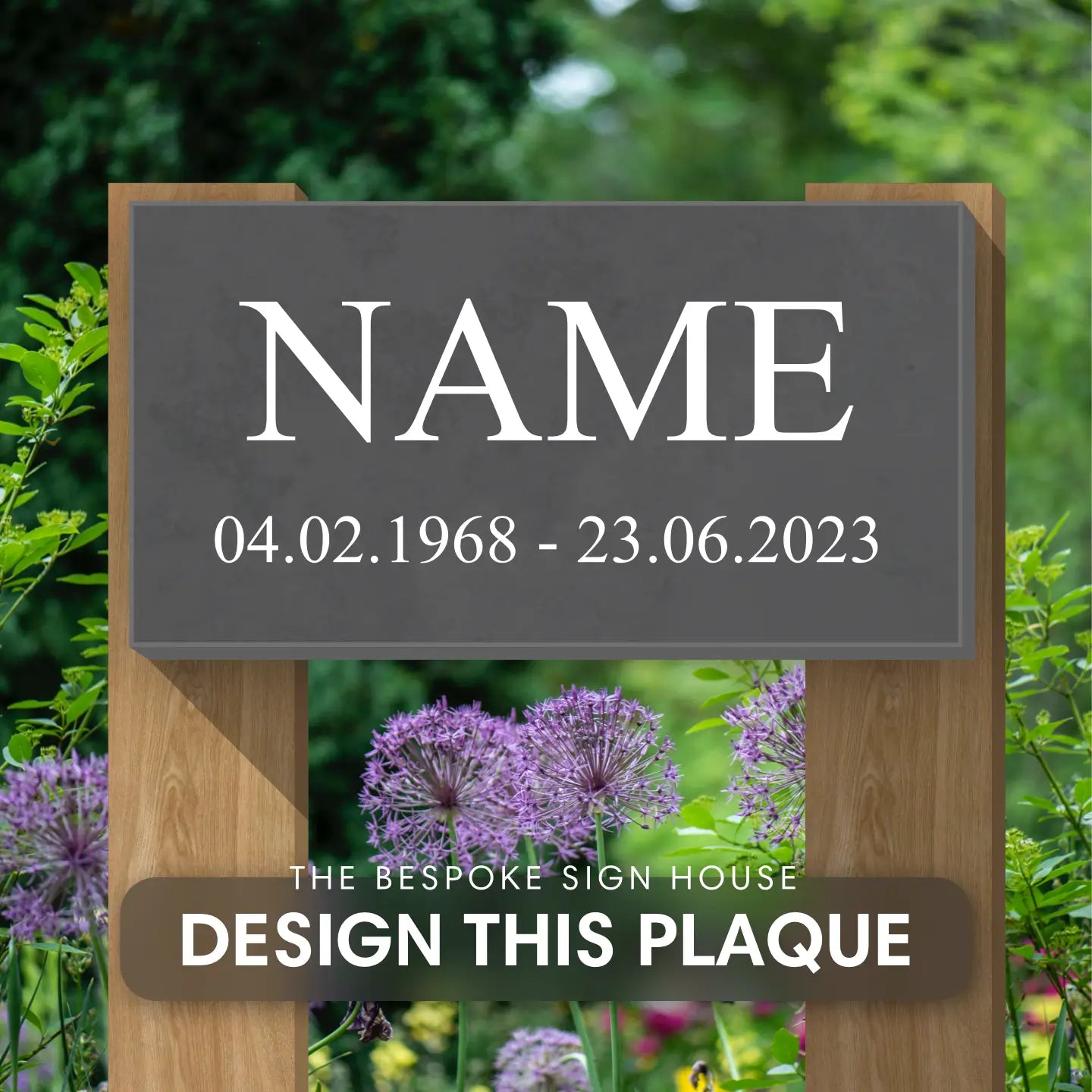 A memorial message grave plaque made out of slate and displayed in a garden on wooden posts.