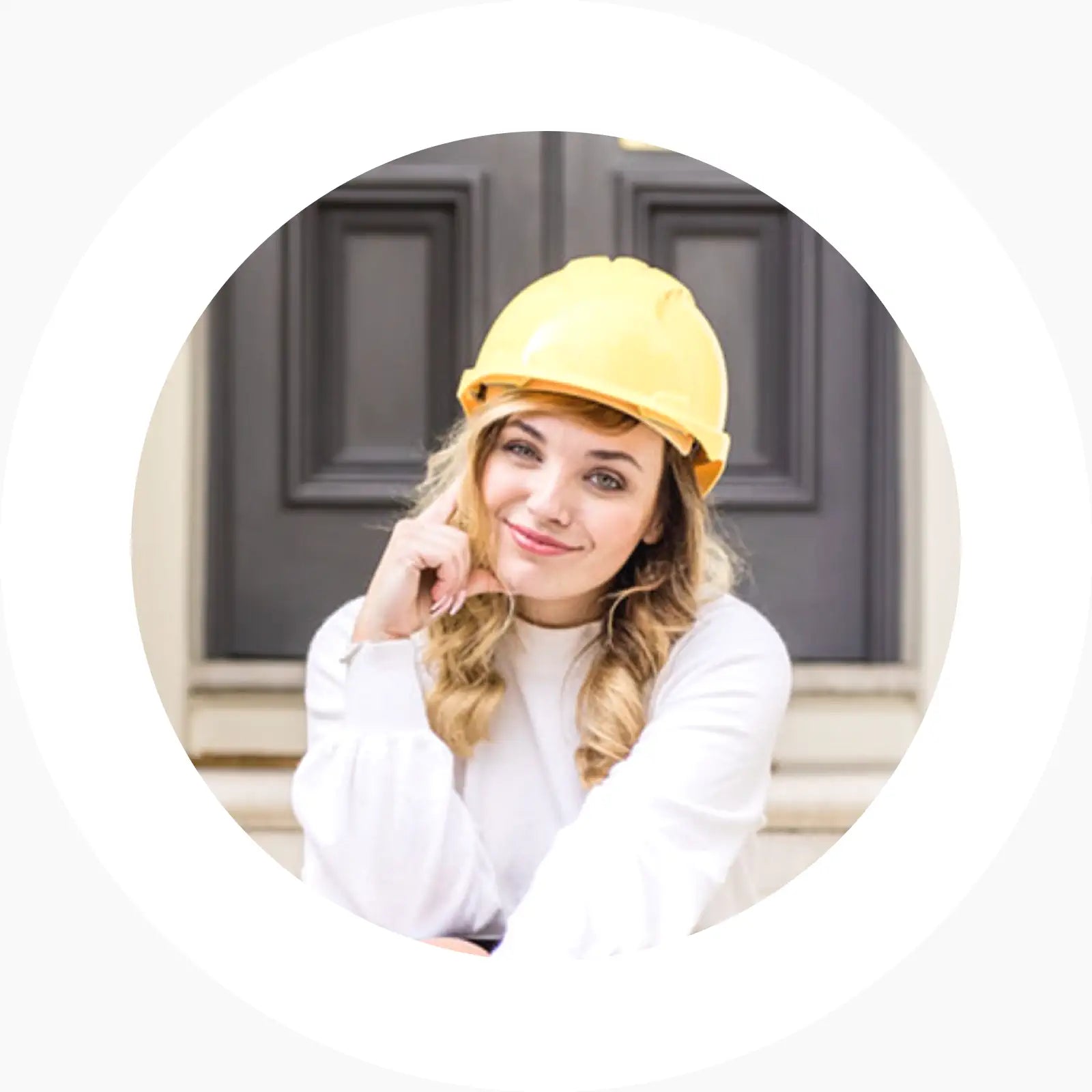 Woman wearing a yellow blazer and white shirt outdoors