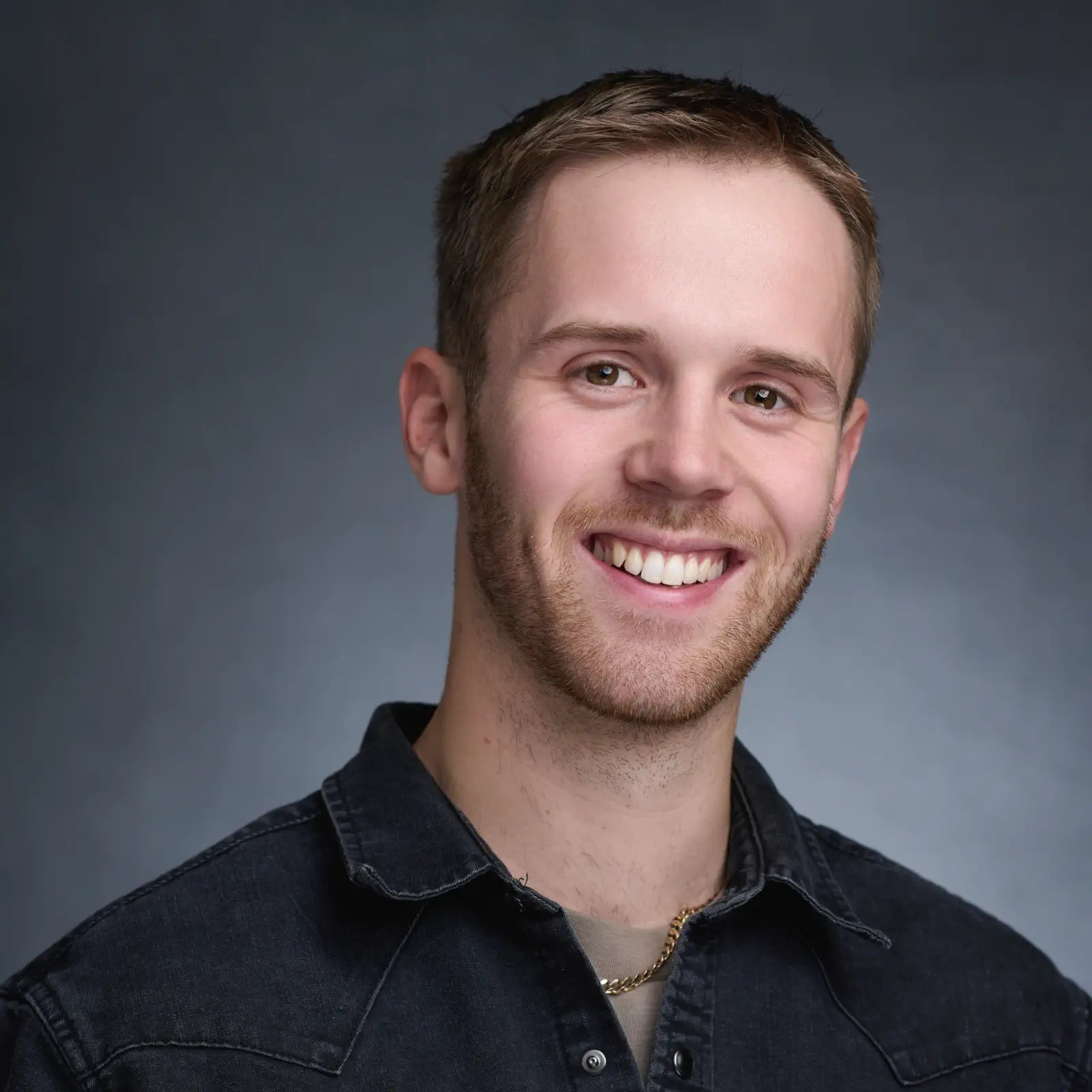 headshot of Kris Goodenough, co-founder of the bespoke sign house