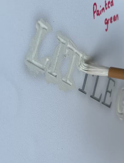 video of our signmaker handpainting a slate sign using a paintbrush. the paint colour is little green olive