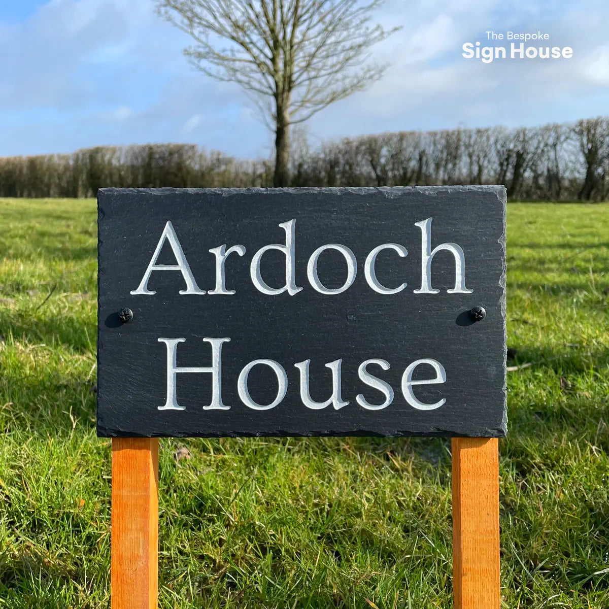 wooden posted welsh house sign