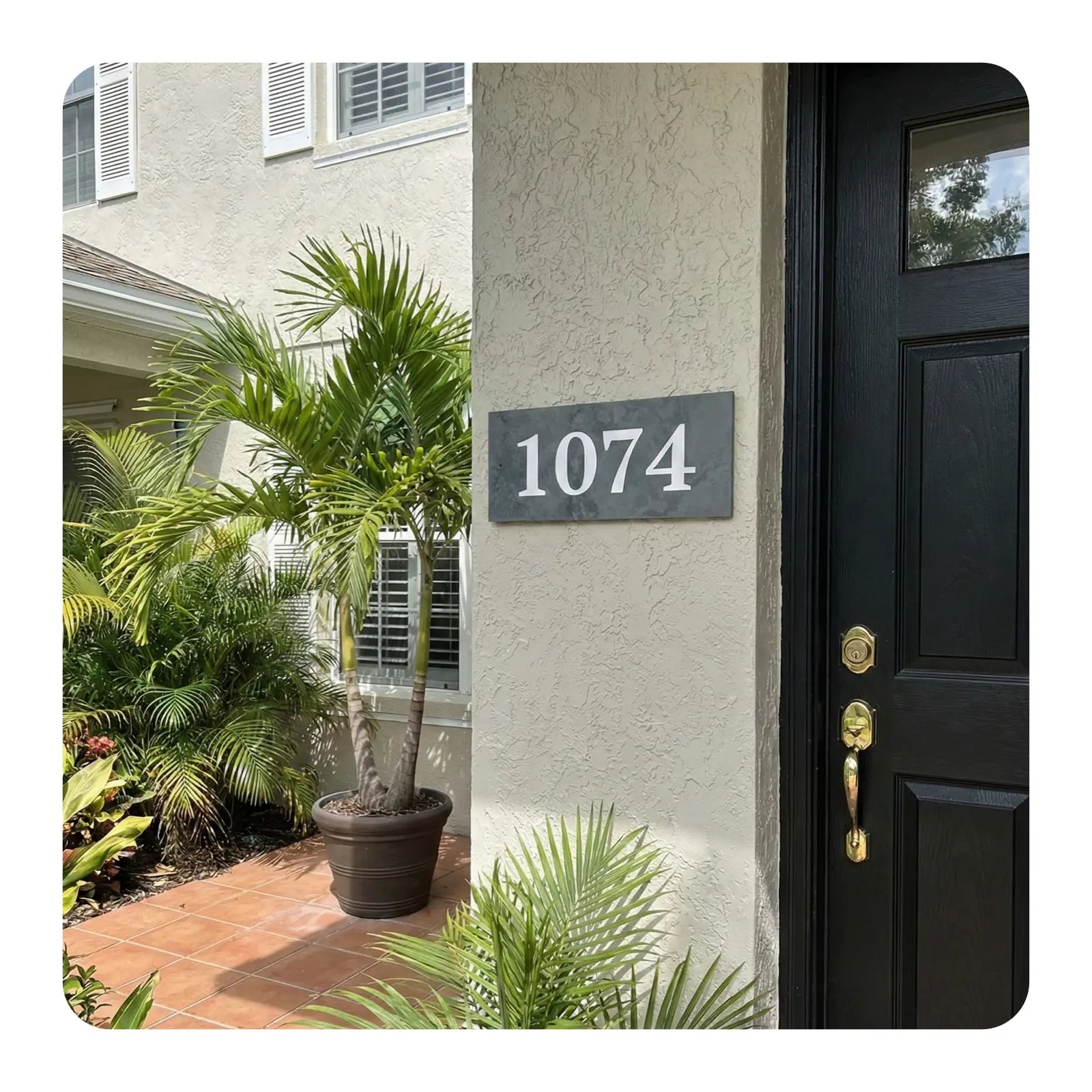 House exterior with address number 1074 and a black door.