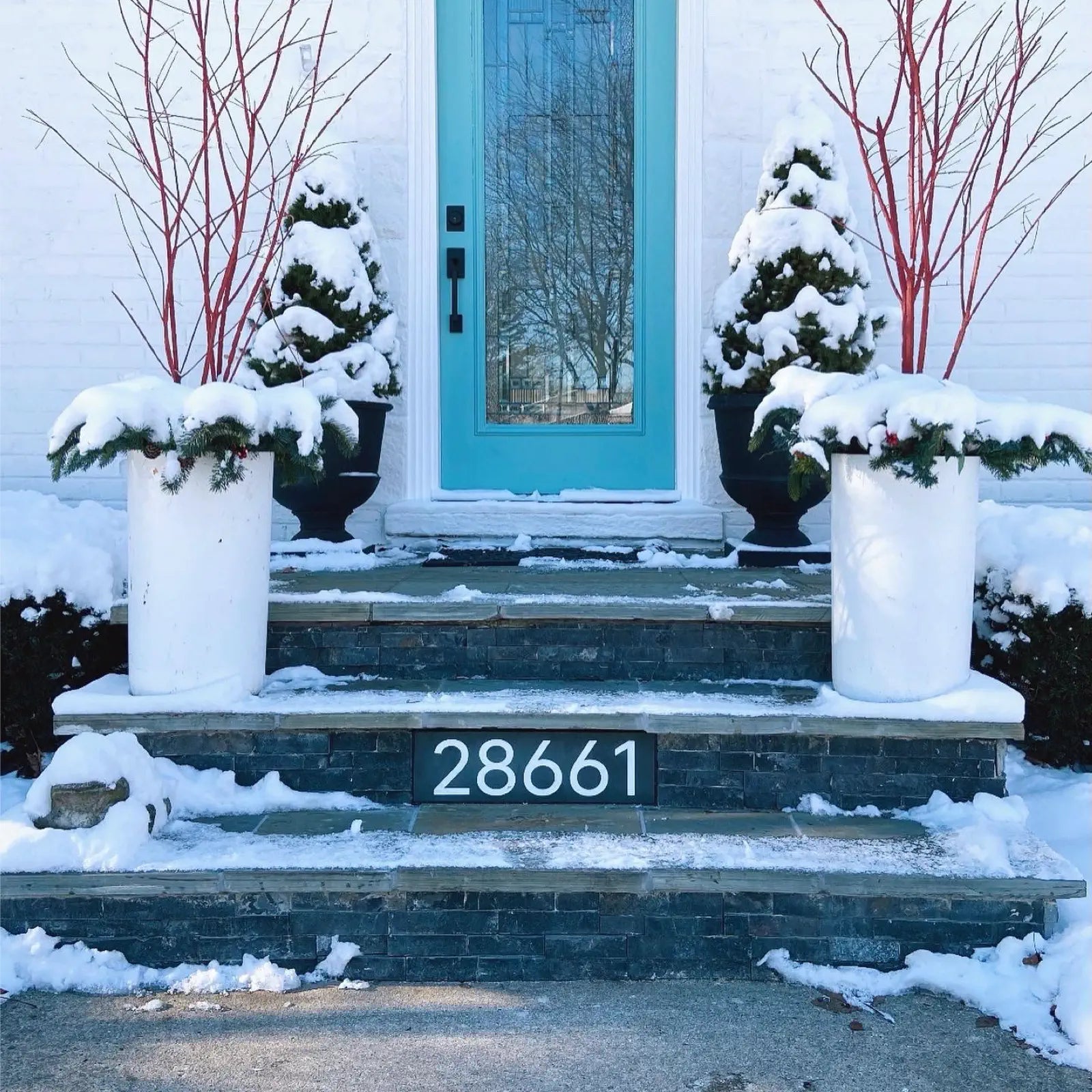 Slate number sign fixed in stone stairway