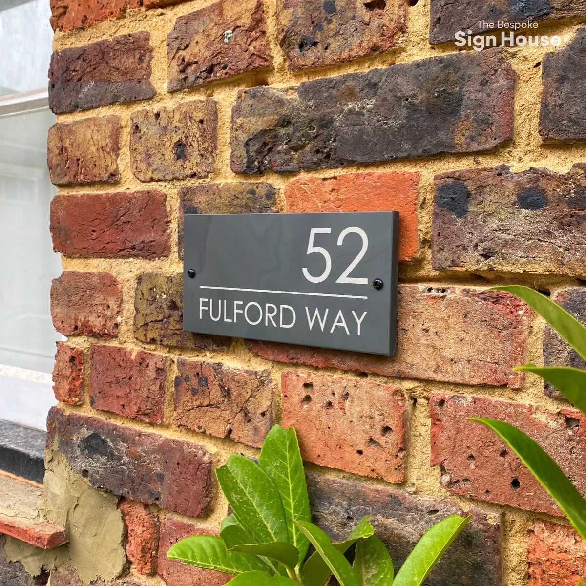 natural slate sign on brick wall