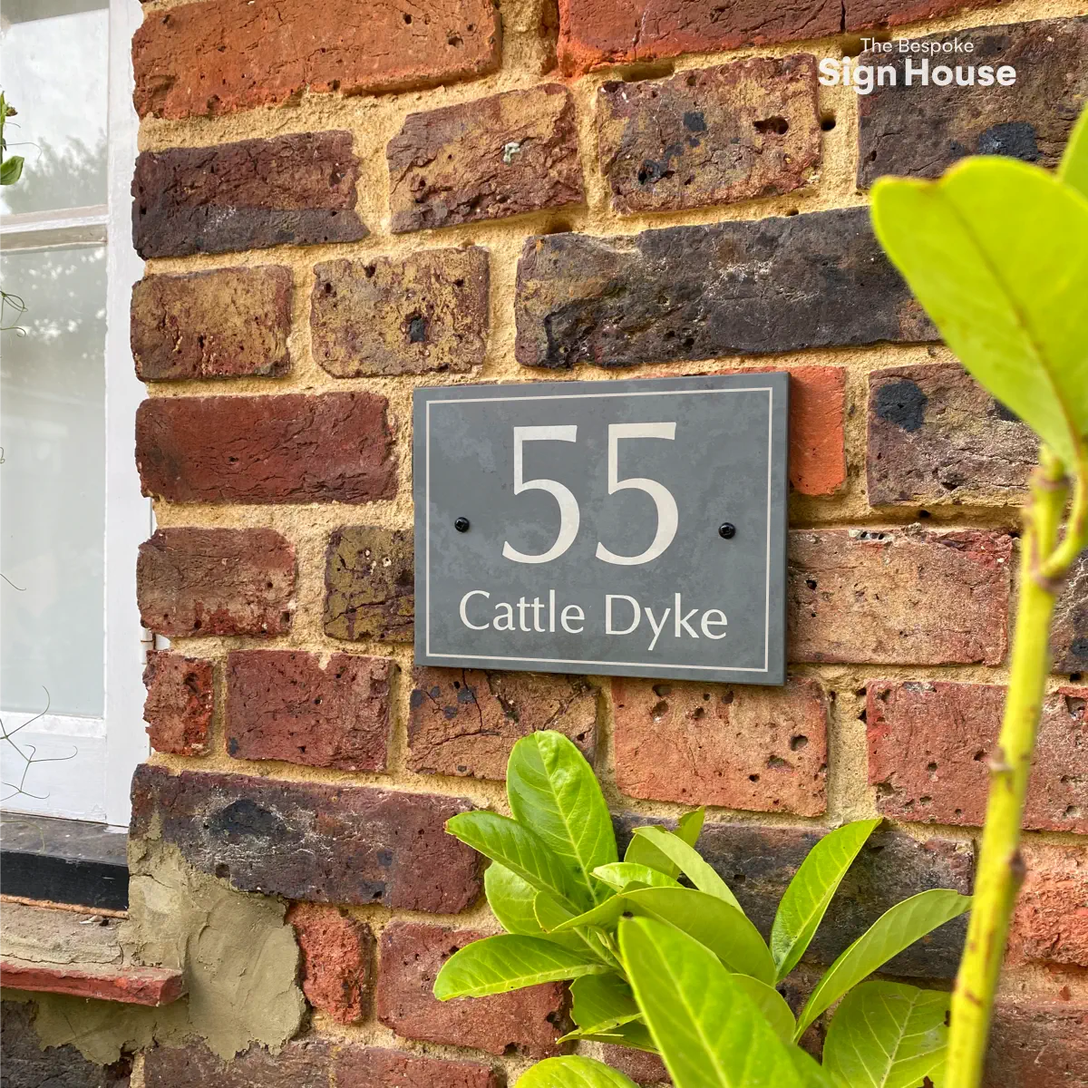 edge border design etched onto slate sign