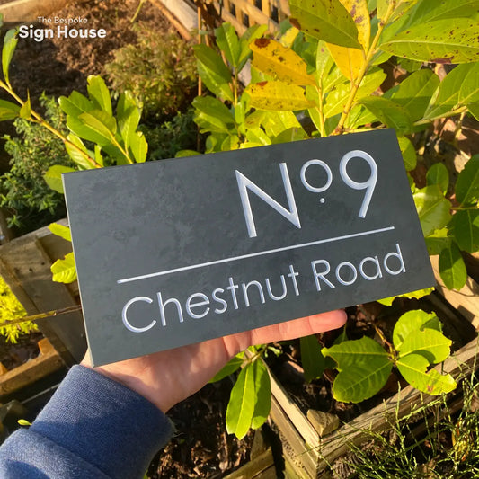 contemporary slate house sign with white engraved lettering