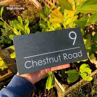 contemporary slate house sign with white engraved lettering